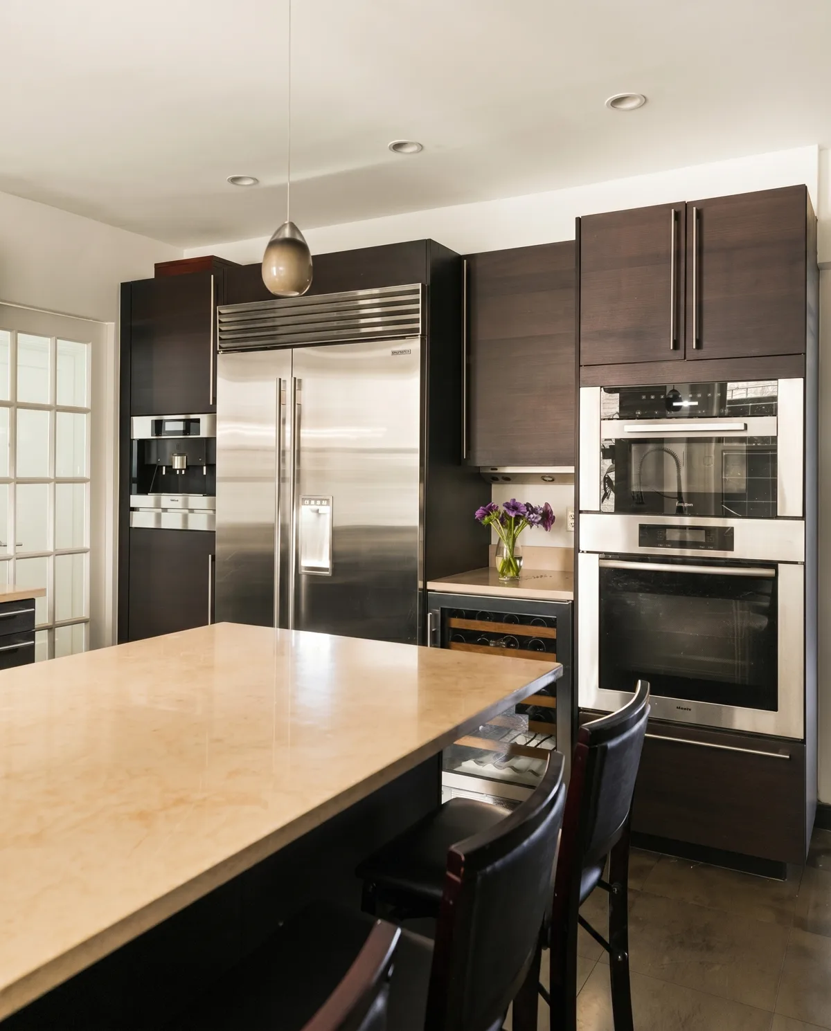 The appliance wall with Sub-Zero refrigeration and Miele ovens