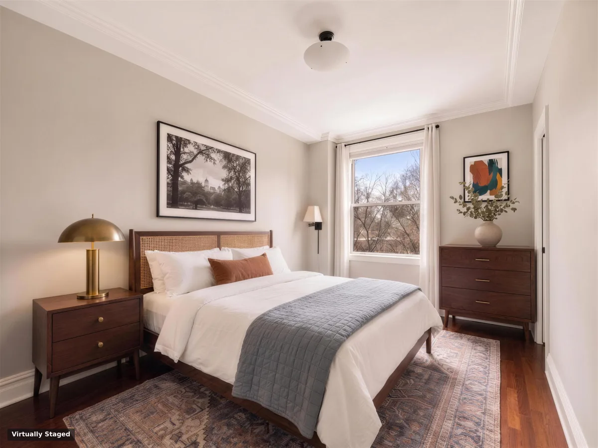 A park-facing bedroom, virtually staged